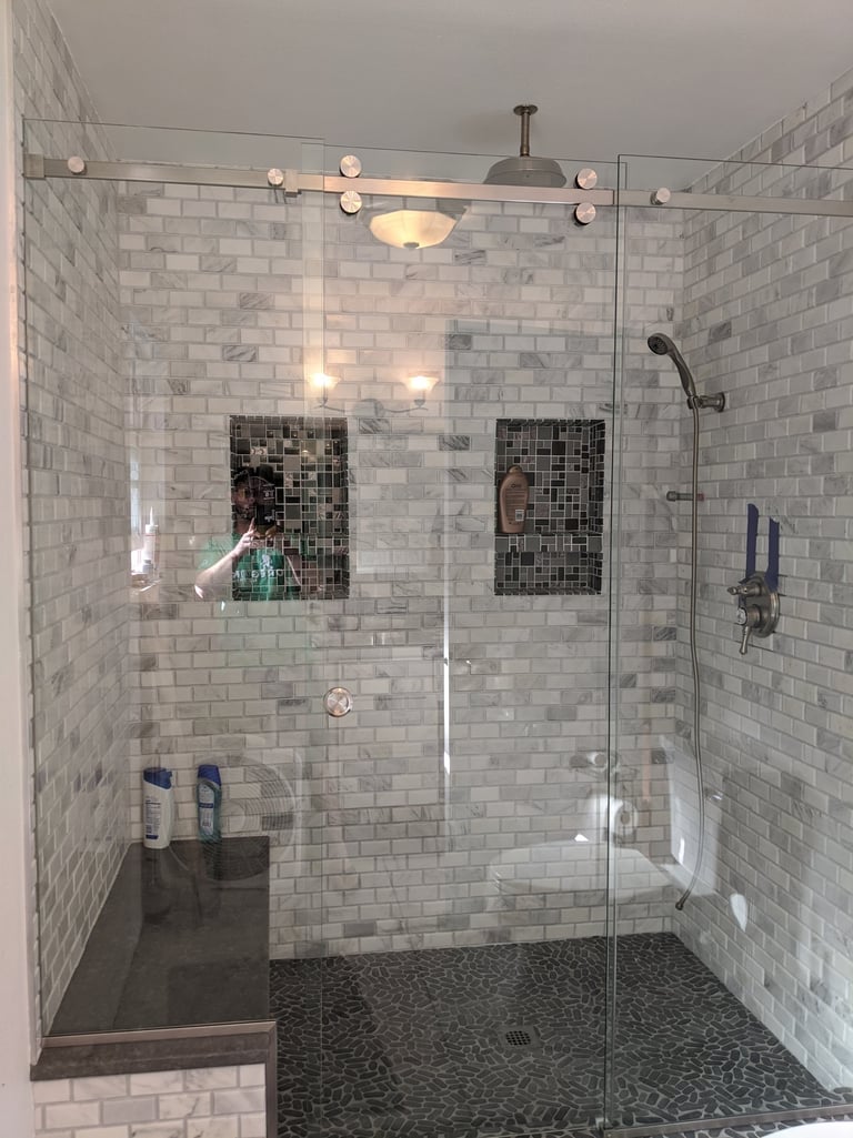glass shower barn doors with subway tile
