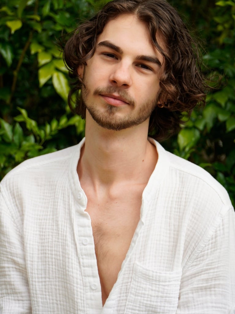 a man with a beard and a white shirt