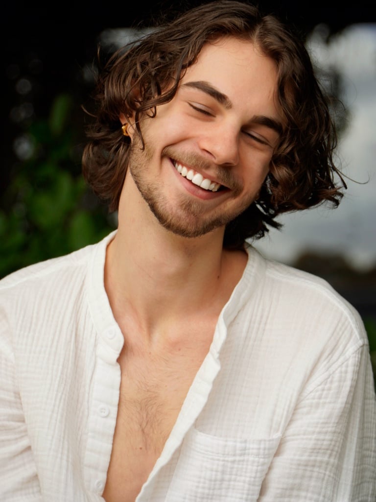 a man with a beard and a white shirt