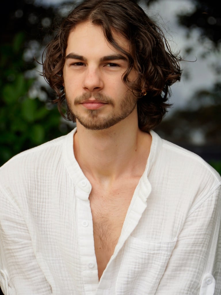 a man with a beard and a white shirt