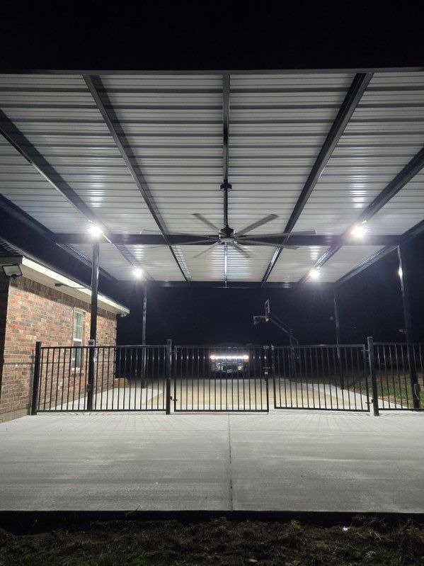 Black Fence with Fan Above