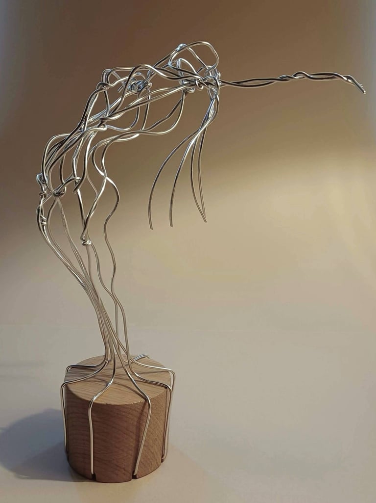 A wire sculpture of a complete female figure, standing, bending over backwards, arms out