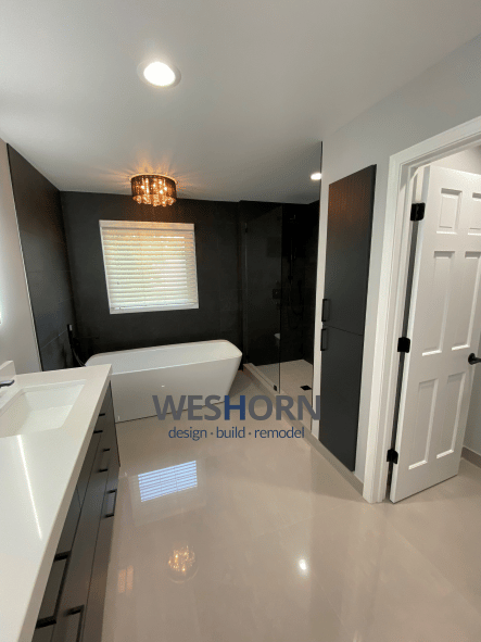 A bright, modern bathroom featuring sleek fixtures and a spacious walk-in shower.