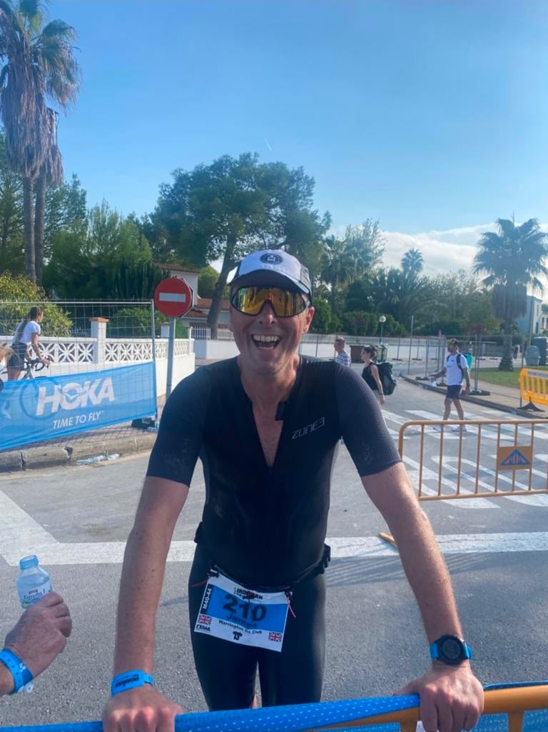 James Oswald Coaching athlete celebrating at Ironman Majorca 