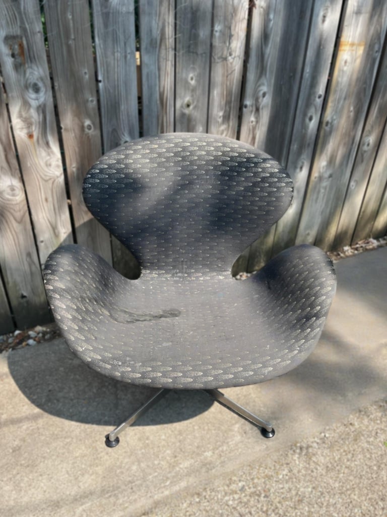 swan chair before with faded and damaged fabric