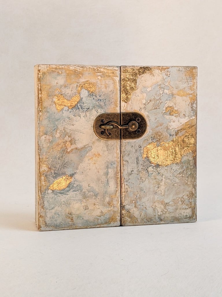 Handcrafted folding altarpiece abstract painting, gold leaf accents, and a metal swing latch.