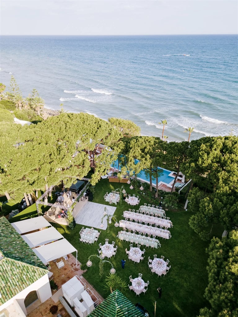 Aerial view of beachfront wedding reception in Marbella