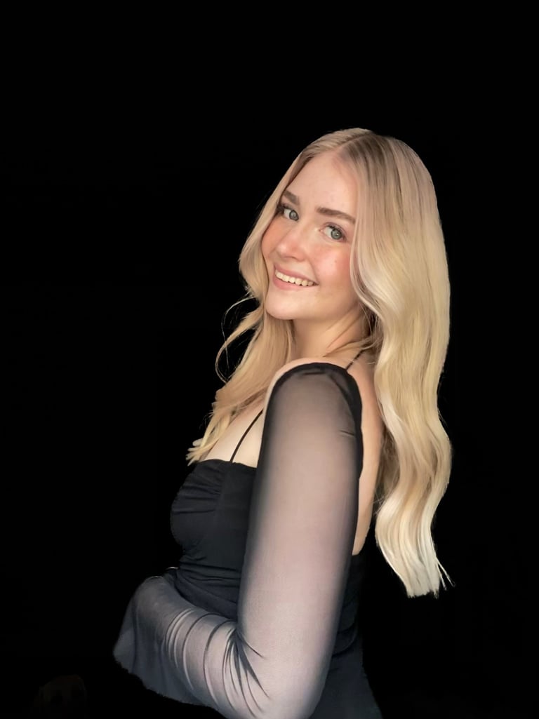 Nicole fine line tattoo artist creating elegant feminine tattoos at Aura Tattoo Studios