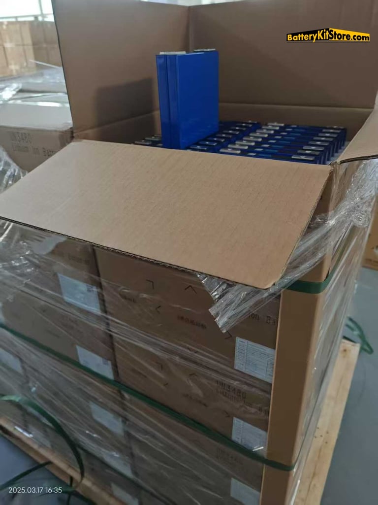 EVE lithium cells in carton boxes arranged on a pallet in a warehouse