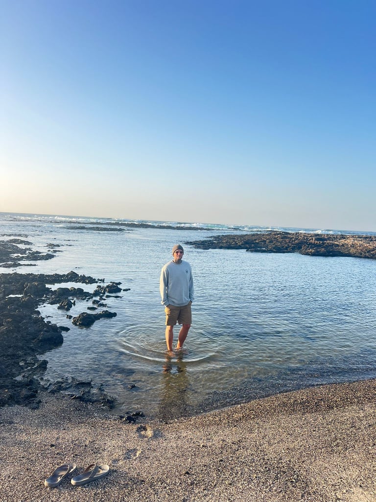 Seamusthefreenomad standing in the sea at the beach