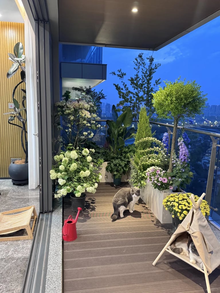 Cozy balcony corner with a small table, comfortable chair, plants, and space-saving design details.