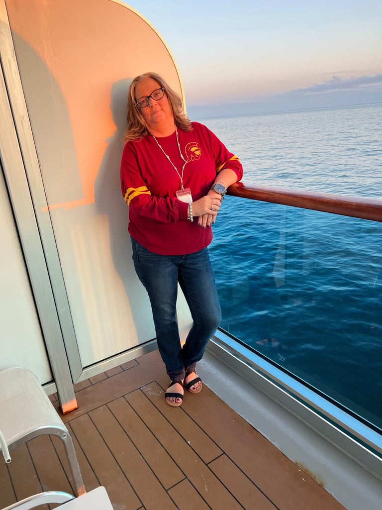 Shelly on a balcony of a Carnival Cruise to Alaska 