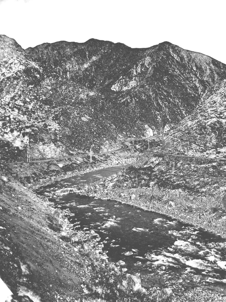 a black and white photo of a mountain scene