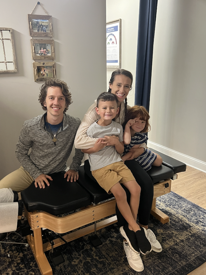 Happy family smiling after gentle chiropractic adjustment in Franklin TN