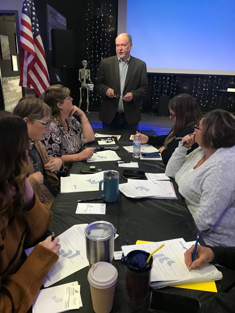a group of people sitting around a table