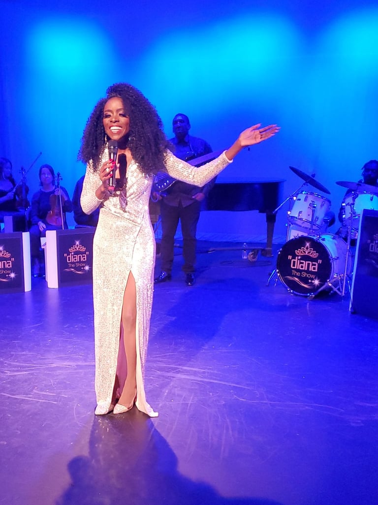 a woman in a white dress standing on a stage