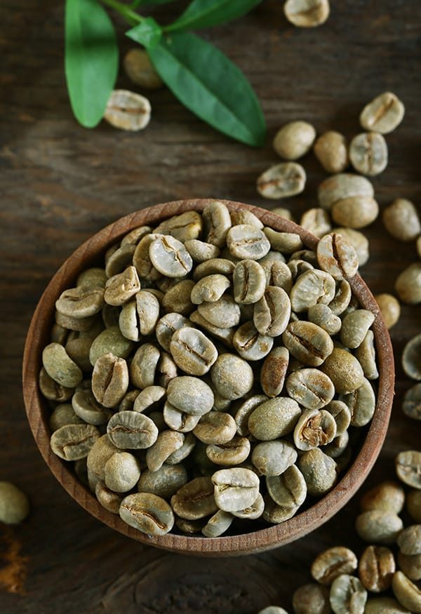 a bowl of coffee beans and a bowl of coffee beans