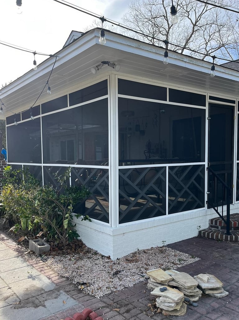 Custom screen system on a Pawleys Island porch for outdoor comfort.