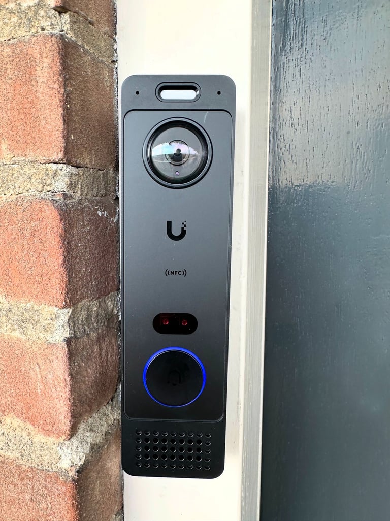 Ubiquiti UniFi Protect security camera dashboard showing a delivery person on a balcony.
