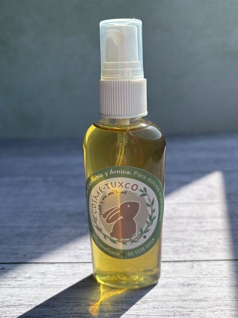 Natural cannabis and arnica massage oil spray for muscle pain relief in a glass bottle.