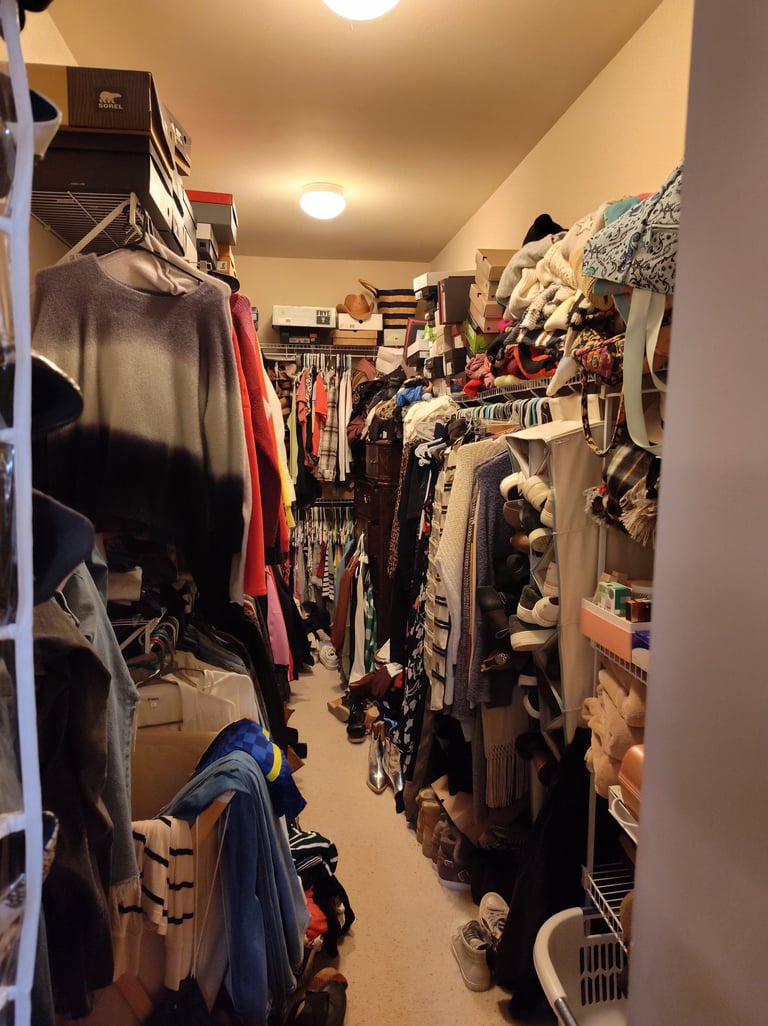 Cluttered closet by Tina Wilmhoff RevampT Spaces Cincinnati  Northern KY