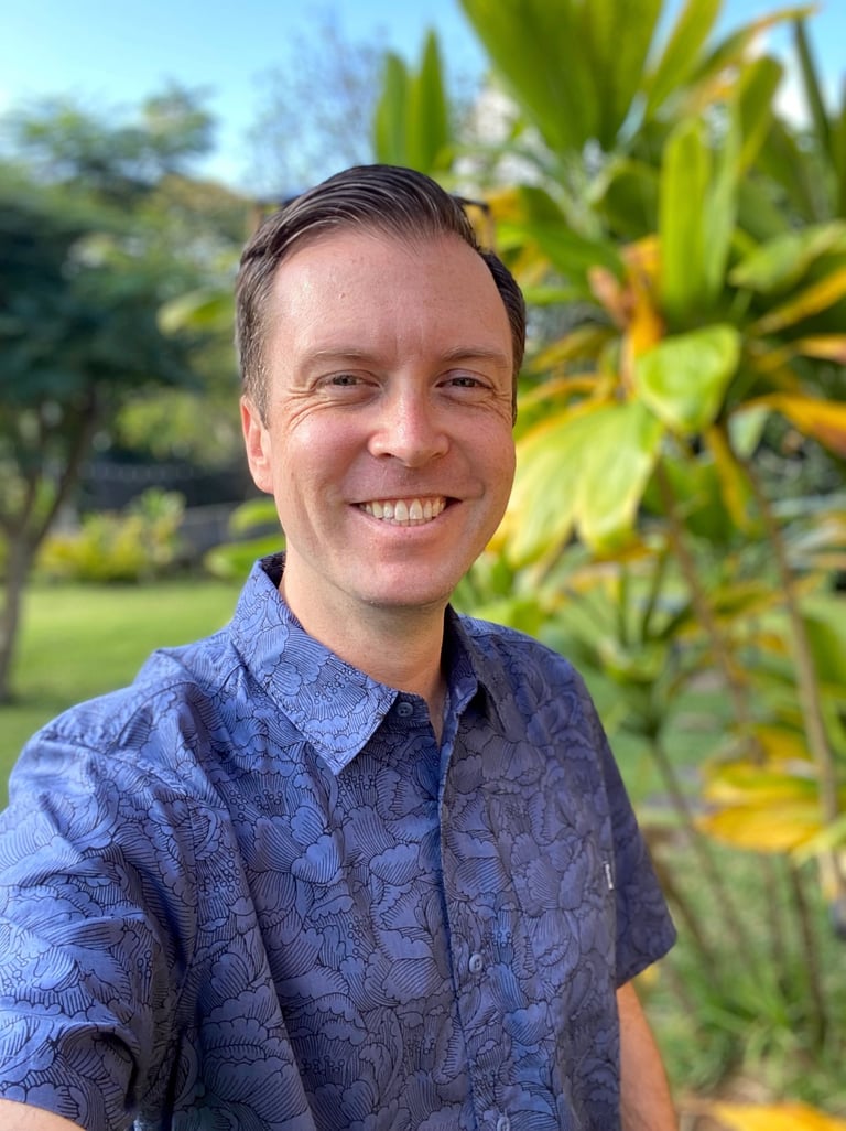 man wearing blue aloha shirt