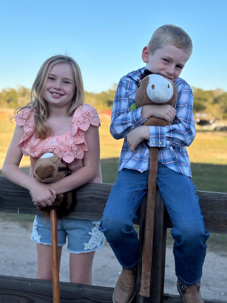 Kids waiting for their turn at the Stick Horse Rodeo game during a pony ride birthday party