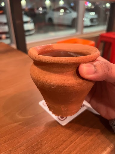 A customer Holding Our Cup