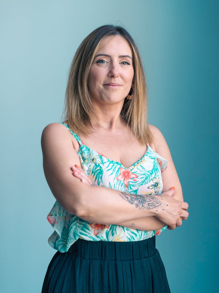 a woman with tattoos on her arms and arms crossed