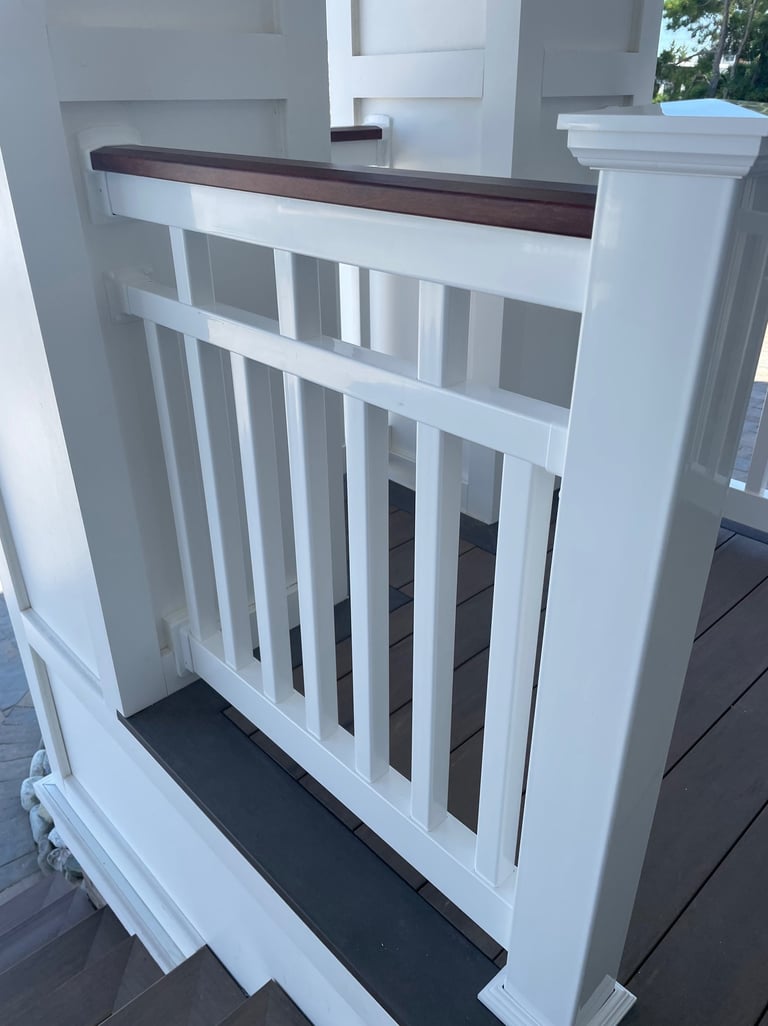Vinyl patriot railing with mahogany woodgrain vinyl wrapped top