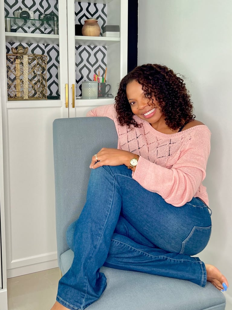 a woman sitting on a chair in a room