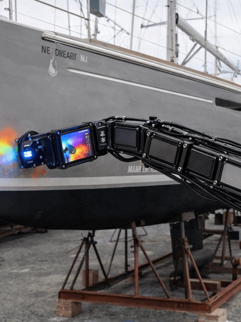 robot inspecting thermal imaging vessel hull in shipyard