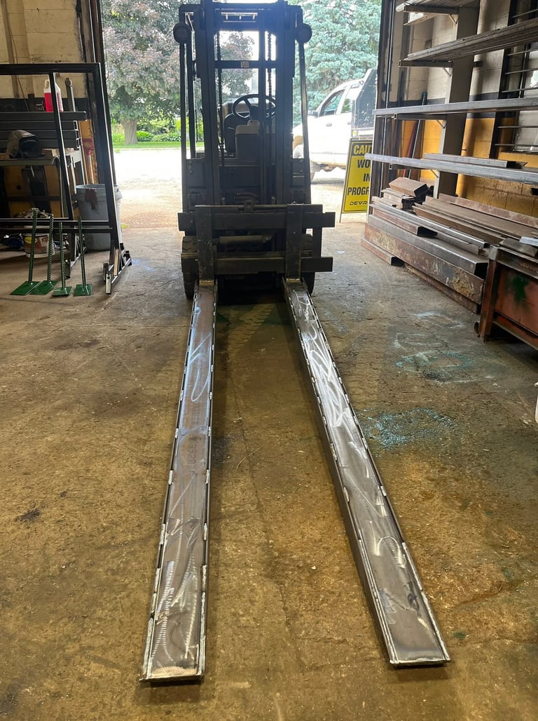 fork lift fork extensions displayed on fork lift