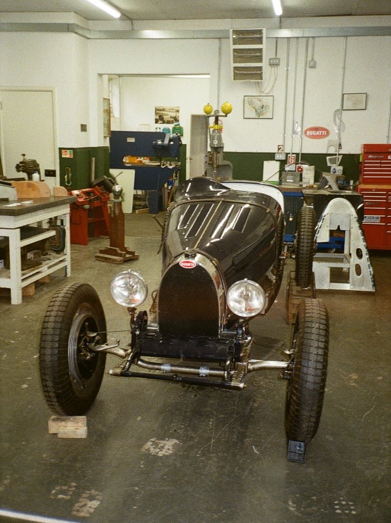 a vintage car parked in a garage