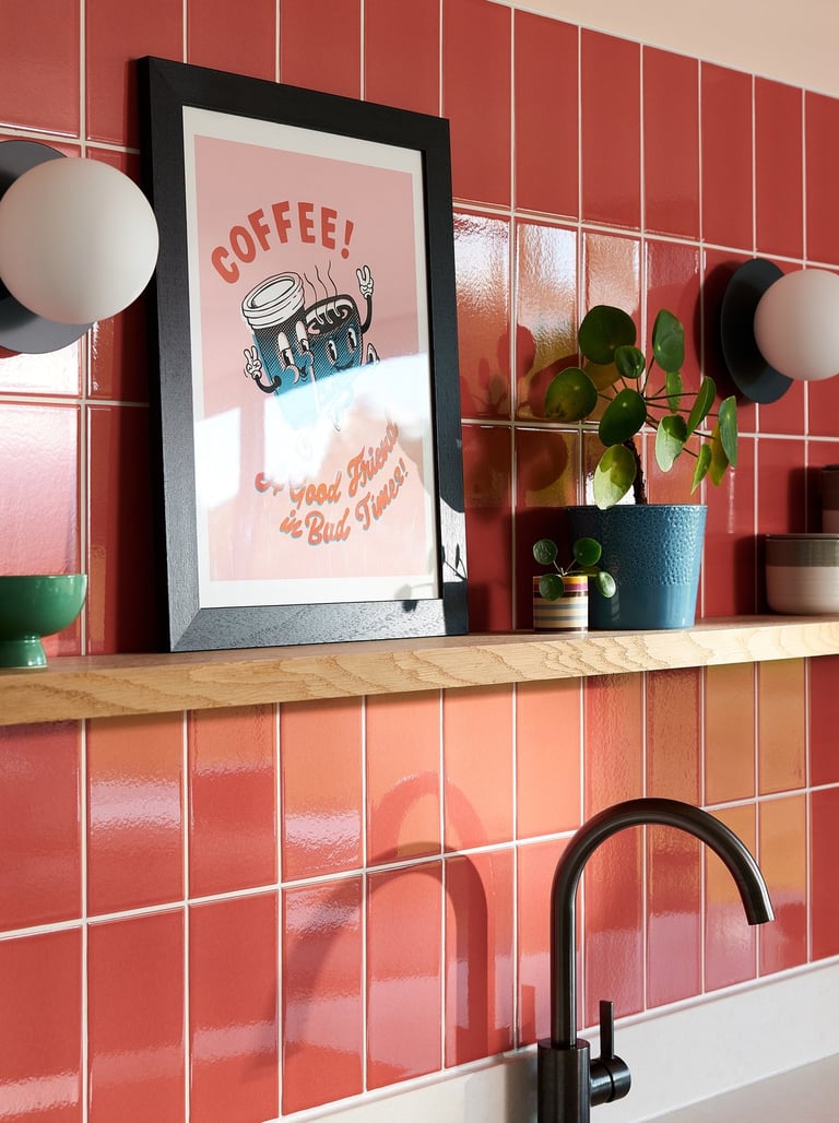 Glossy coral wall tiles with white grout in a modern kitchen splashback, featuring pastel pink