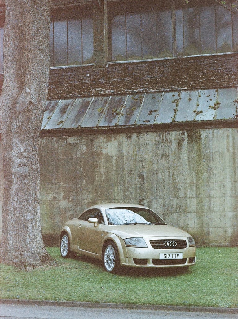an Audi TT parked on grass 