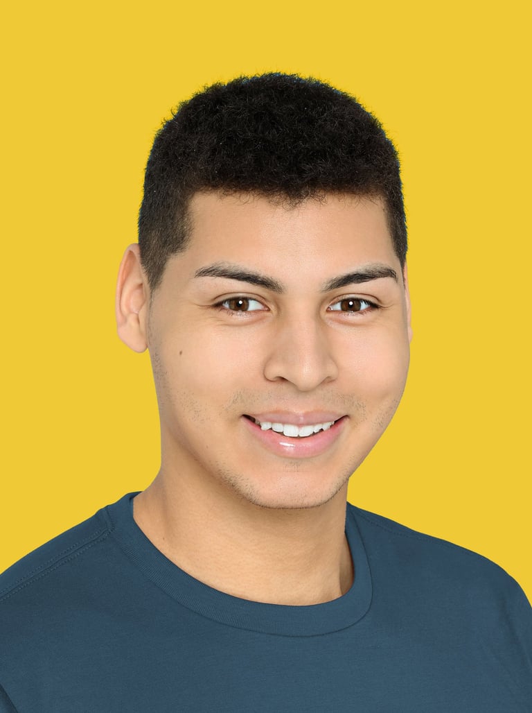Issac Ellis actor headshot smiling portrait on yellow background