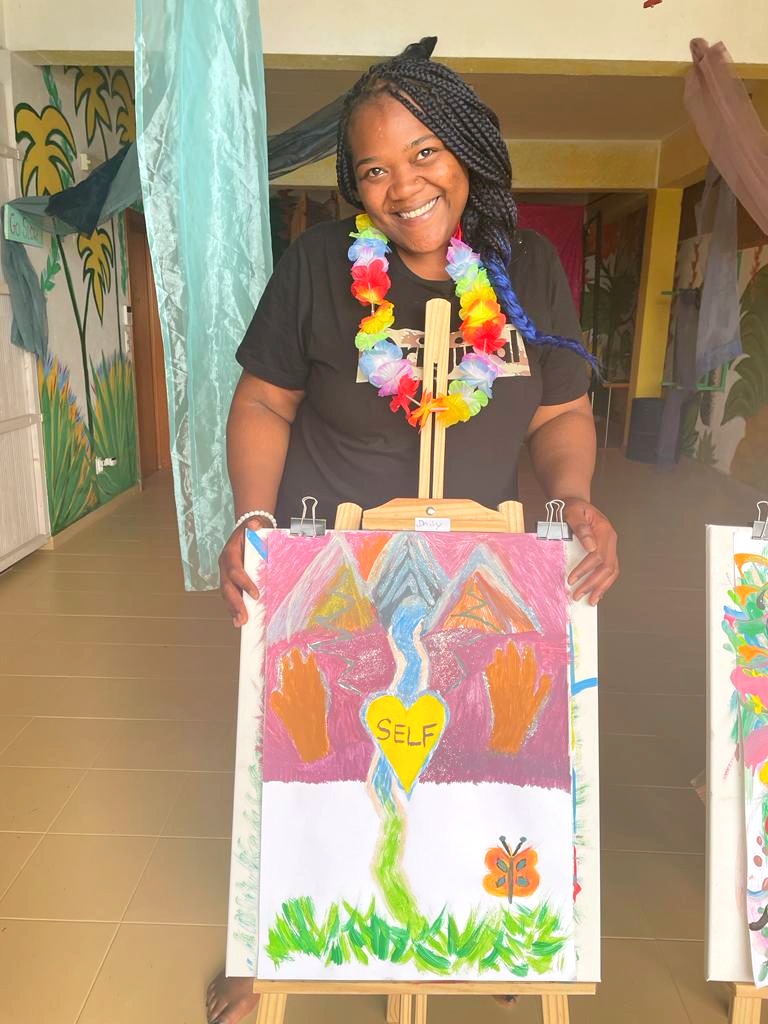 a woman holding a painting of a painting of a woman