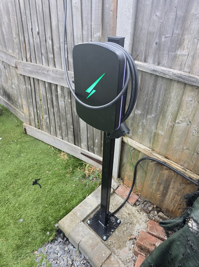 Post-mounted EV charger installed in a rear garden in Thurrock for charging a car parked outside the garden.