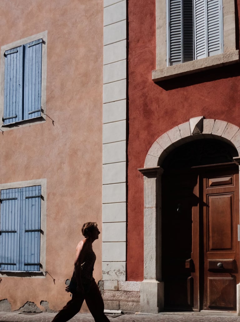 a woman walking down a shiny street