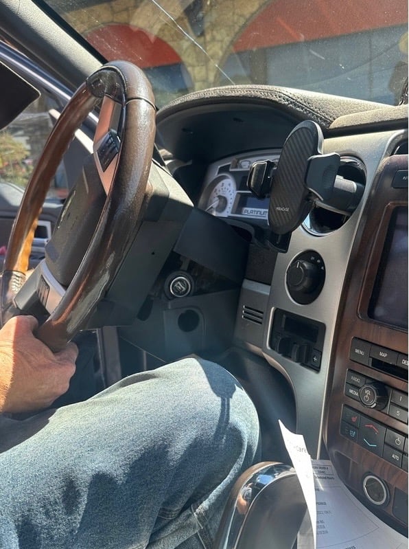Ignition repair in Woodfin NC with locksmith working inside vehicle