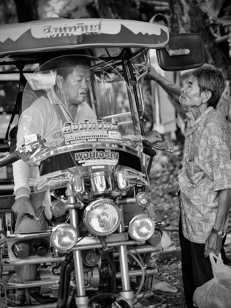Negotiating a tuk-tuk ride in Thailand, spotted by Peter Pickering
