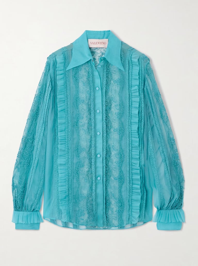 Valentino turquoise lace blouse with sheer panels and ruffle details – luxury designer fashion.