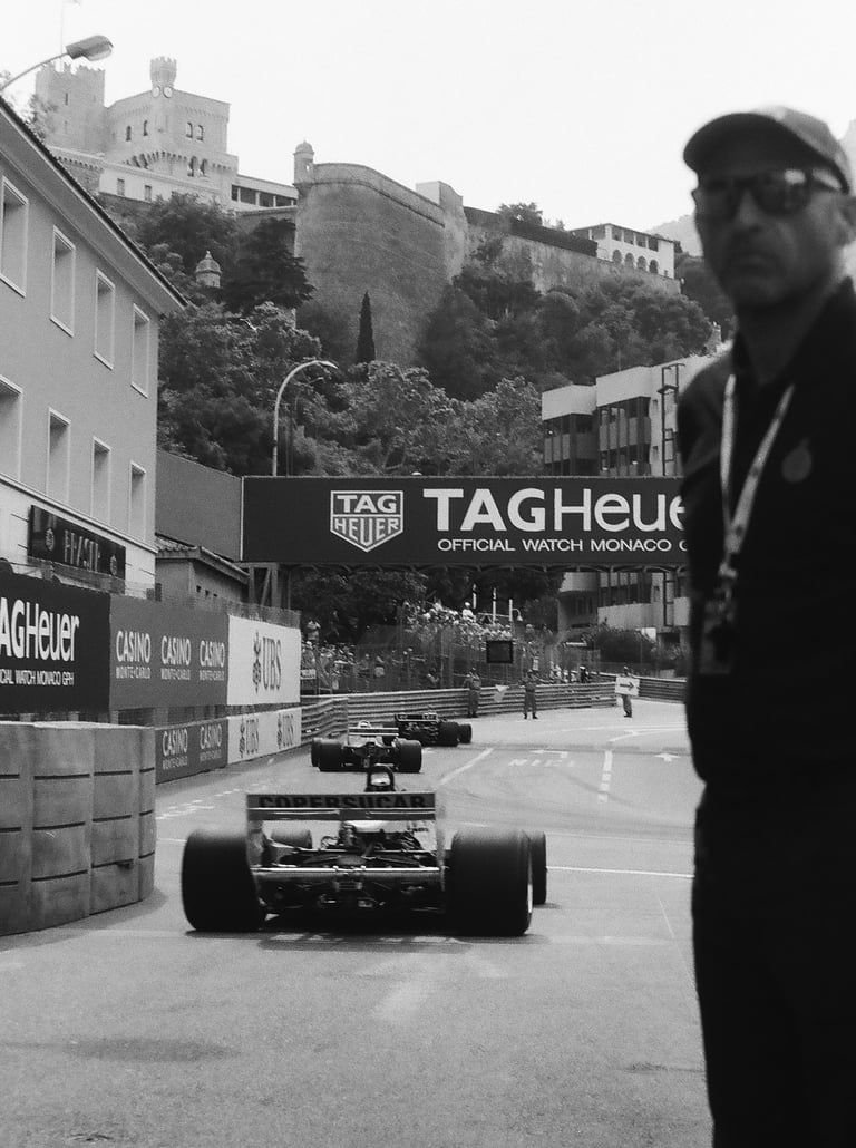 a race marshal watching the race cars get onto the circuit