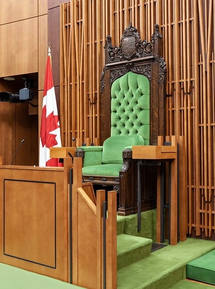 a green chair with a canadian flag