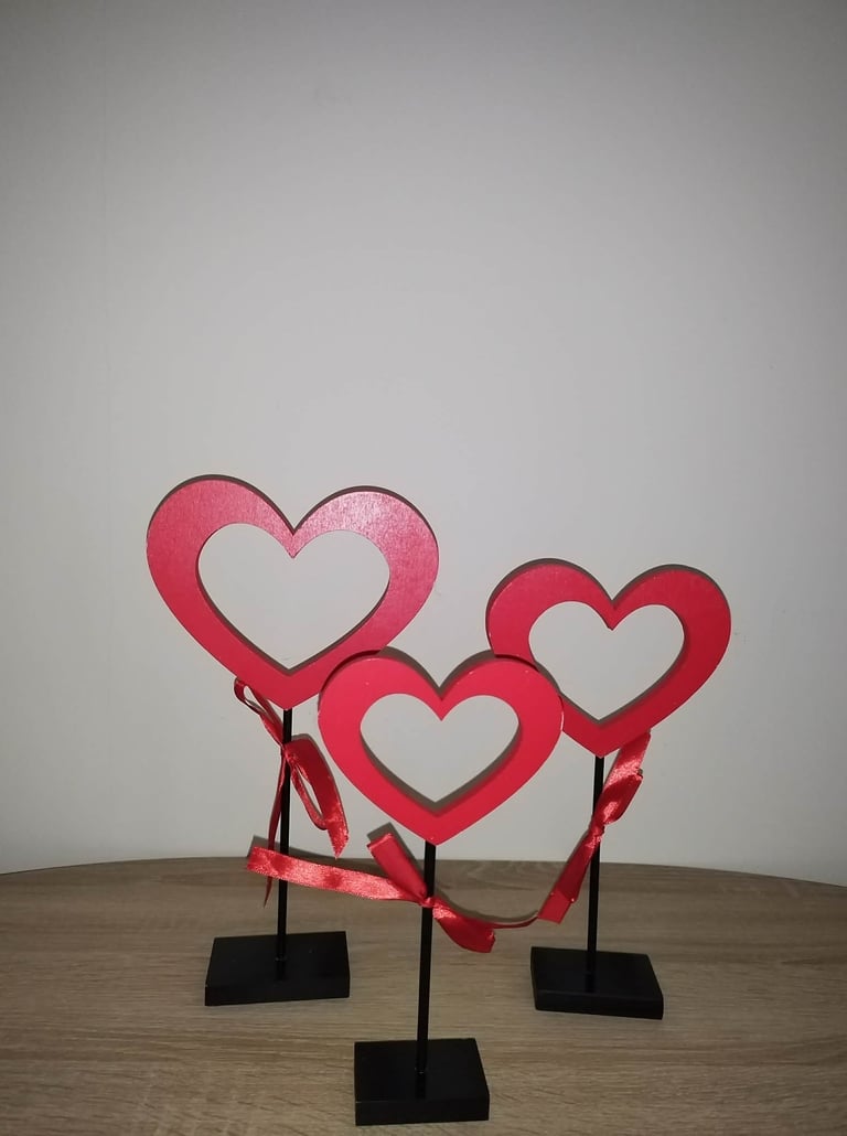 Set of three red Valentine’s Day heart wooden signs on stands, decorative tabletop love accents 