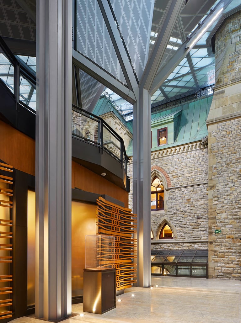 a large gallery with a stone walls and floors