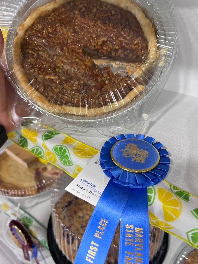 A first-place blue ribbon awarded to a homemade pecan pie at the Maryland State Fair.