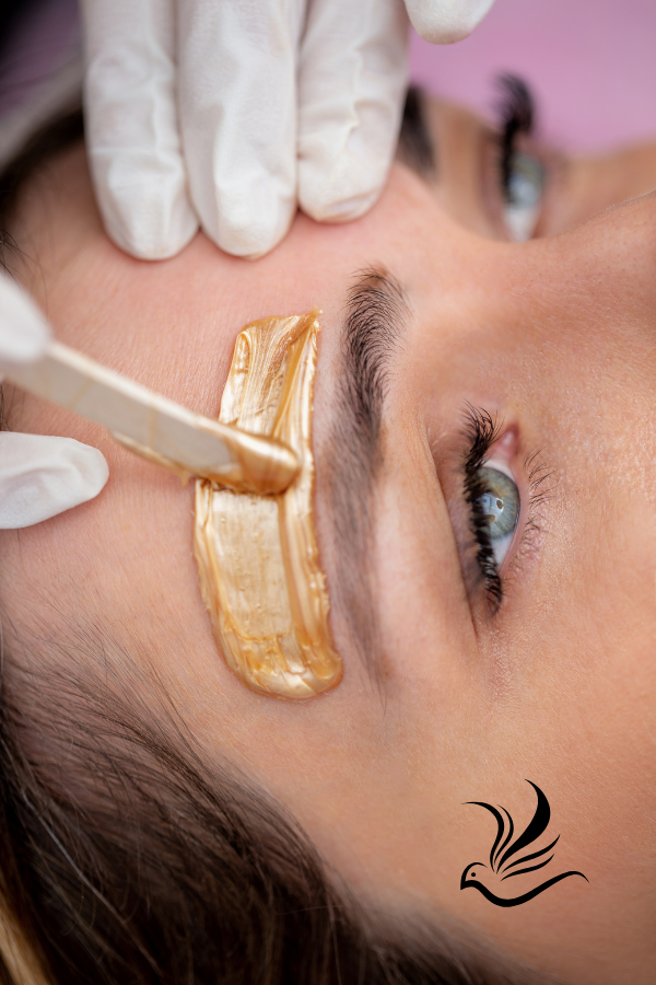 a woman with a gold eyeliners and a gold eyeliners