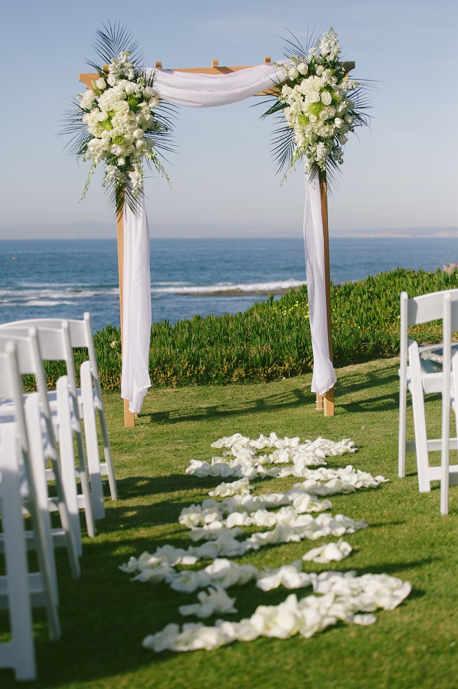 wedding arbor with white flowers at cuvier park, la jolla